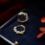 Twisted Gold-Plated Earrings with Pearl Detailing